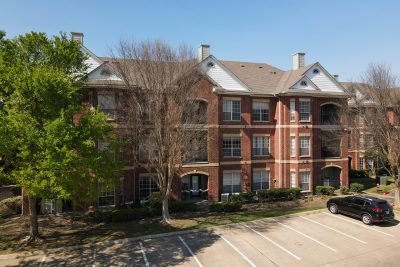 Modern apartment building exterior at The Enclave at La Frontera Round Rock